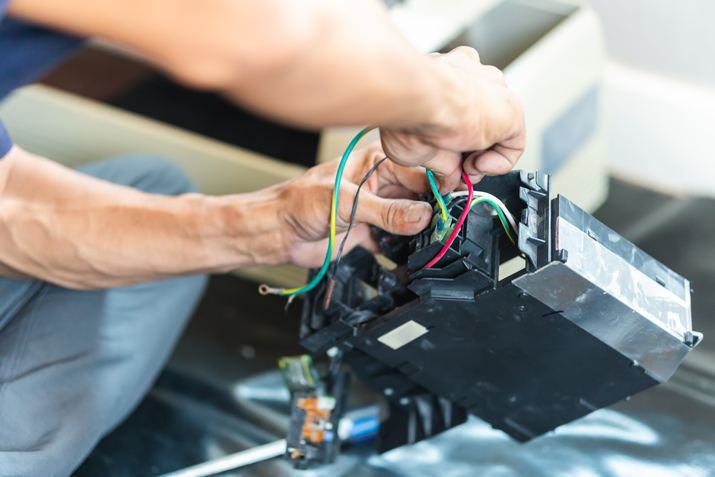 technician working on furnace repair