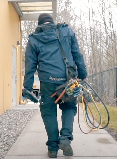 customair employee walking with equipment